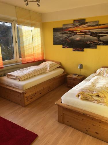 a bedroom with two beds and a window at Julien Felix 1 in Kierspe