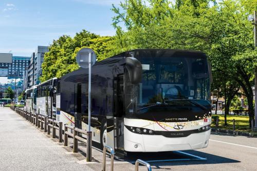 a bus parked on the side of a street at LA SUITE ENCHANTÉE Disneyland Paris in Serris