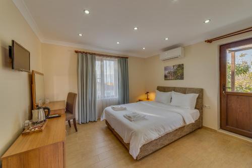 Katil atau katil-katil dalam bilik di Anatolia Hotel Geyre Karacasu Aydın (Aphrodisias)