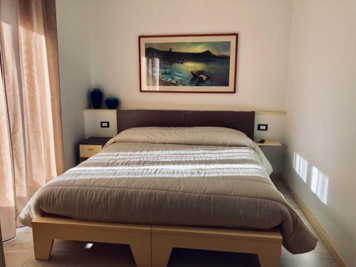 En eller flere senge i et værelse på Brezza Marina