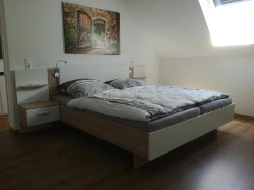 a large bed in a room with at Haus - Anni in Blieskastel