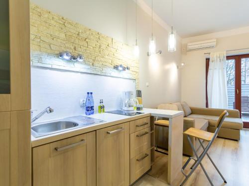 a kitchen with a sink and a counter at Rent like home - Marea in Międzyzdroje