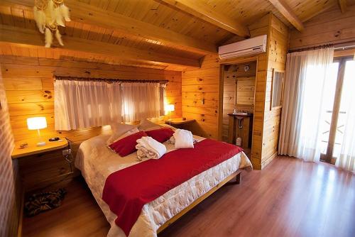a bedroom with a large bed in a cabin at Rancho Paradise - Adults Only in Nono
