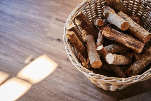 a basket of cinnamon sticks sitting on a wooden table at The Luxury Penthouse at Casita Palmera in Haría