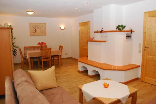 a living room with a couch and a table at Ferienhaus Becker in Schönau