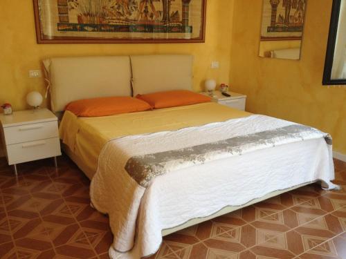 Postel nebo postele na pokoji v ubytování B&B Margherita