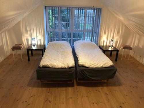 Un pat sau paturi într-o cameră la 103 Hvilestedvej