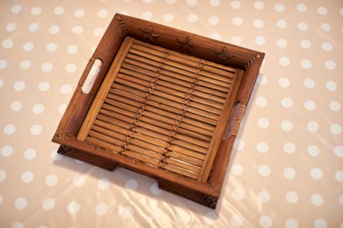 a wooden window with blinds on a wall at Casa Bellavista in Torre Canne