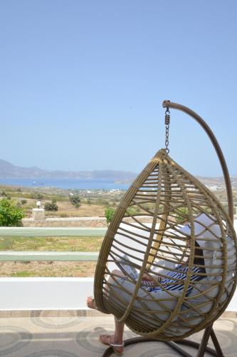 a person is sitting in a swing at Hawk Stone in Adamas