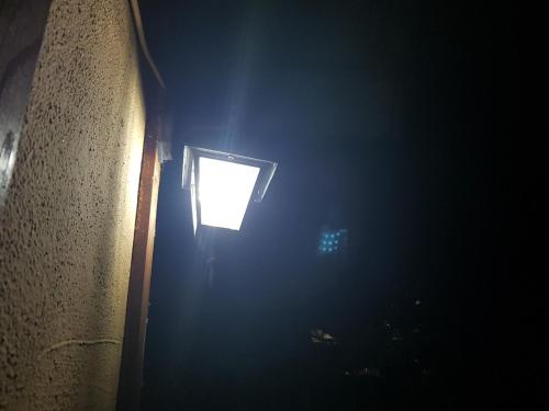 a door with a window in a dark room at Apartments Cosic in Vlasic
