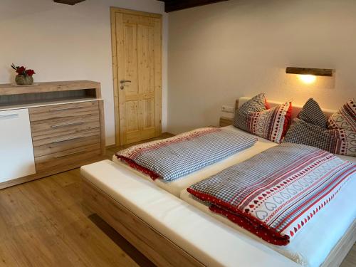 A bed or beds in a room at Hochkirg Lehen