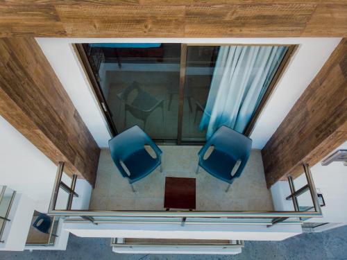 an overhead view of two blue chairs in a room at Playa Linda Hotel in Progreso
