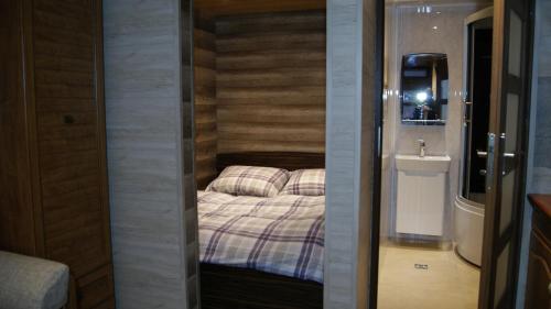 Postel nebo postele na pokoji v ubytování Apartamenty i Domki Taterka