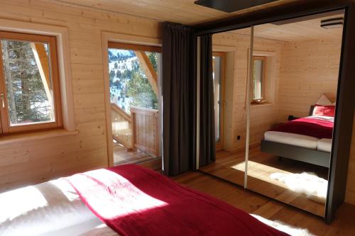 En eller flere senger på et rom på Heidi Chalets Falkert Heidialm - Chalet Almsommer