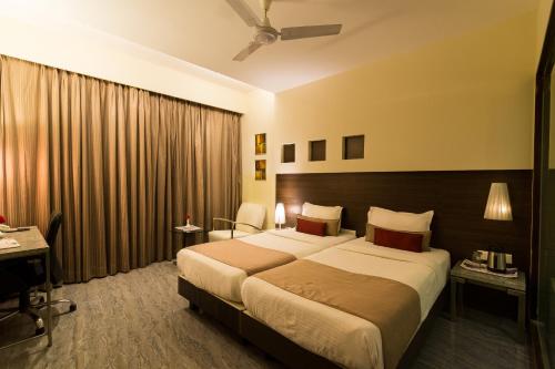 Un pat sau paturi într-o cameră la Sentosa Resorts & Water Park