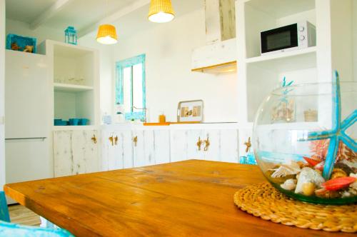 a kitchen with a table with a fish bowl on it at Casa Ada 2 in Famara
