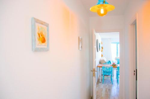 a hallway with a dining room and a table at Casa Ada 2 in Famara