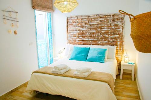a bedroom with a large bed with towels on it at Casa Ada 2 in Famara