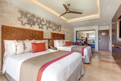 Voodi või voodid majutusasutuse Planet Hollywood Costa Rica by Royalton, An Autograph Collection All-Inclusive Resort toas