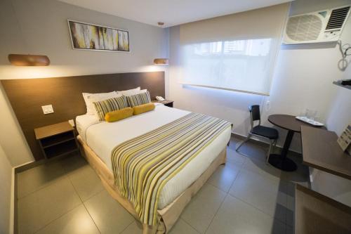 Postel nebo postele na pokoji v ubytování Hotel Ojos Del Rio