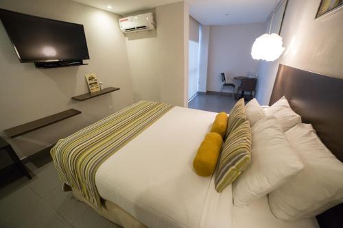 Krevet ili kreveti u jedinici u objektu Hotel Ojos Del Rio