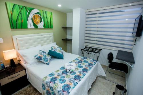 Postel nebo postele na pokoji v ubytování Hotel San Blass Boutique
