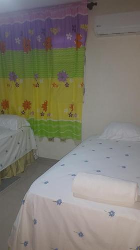 Una cama o camas en una habitación de Hostel Quintonido