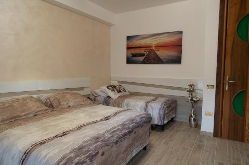 Posteľ alebo postele v izbe v ubytovaní B&B IL CAVALIERE