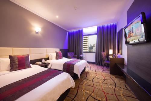 Kama o mga kama sa kuwarto sa AnCasa Hotel Kuala Lumpur, Chinatown by AnCasa Hotels & Resorts