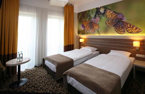 Tempat tidur dalam kamar di Hotel Delfina