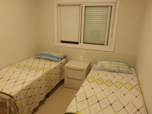 Cama o camas de una habitación en quarto social privado ap compartilhado