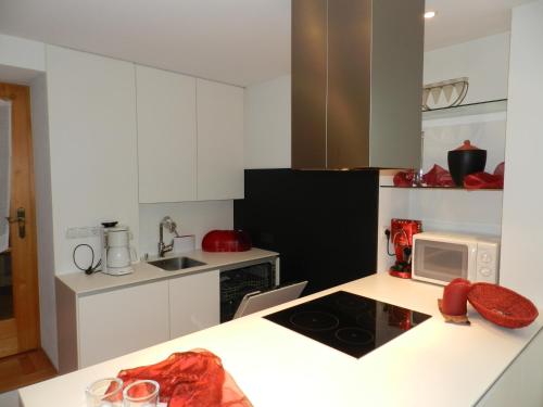a kitchen with white cabinets and a white counter top at Appartment Marent in Schruns