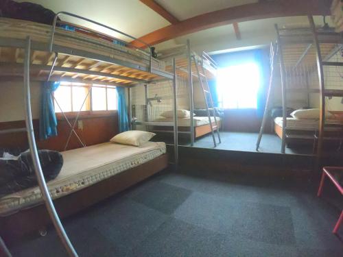 Ένα ή περισσότερα κρεβάτια σε δωμάτιο στο Monkey Rider