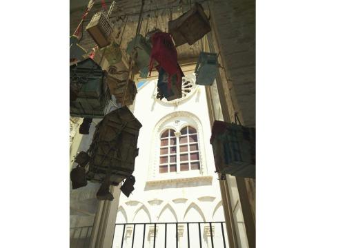 a building with a window and clothes hanging from it at Palazzo Framarino dei Malatesta - Noble Floor - XIV Century in Giovinazzo