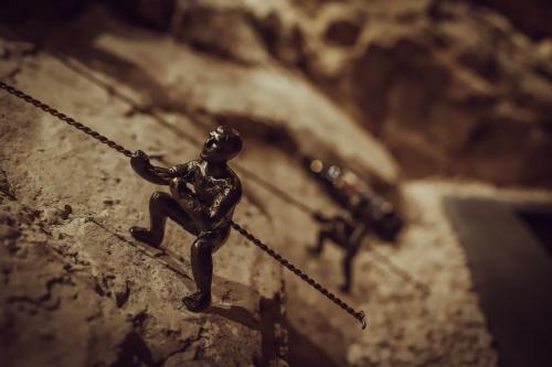 a miniature figurine of a man holding a rope at Hotel Adamo in Tbilisi City