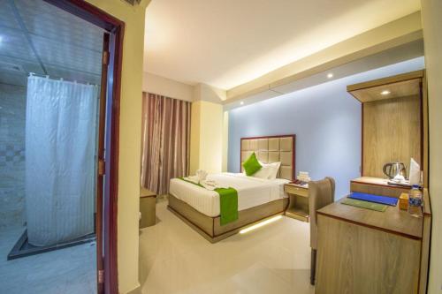 מיטה או מיטות בחדר ב-Hotel Mira Garden