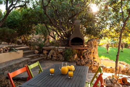 a table with glasses of orange juice on it at Villa Odyssia in Agios Nikolaos