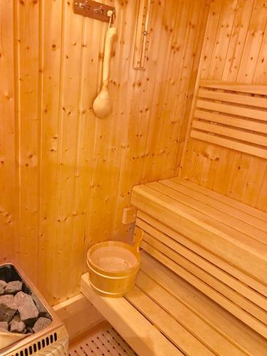 a wooden sauna with a wooden toilet in it at villa in Parnassos in Arachova