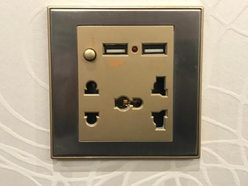 a light switch on a wall at Hotel Famitic Nikko Station in Nikko
