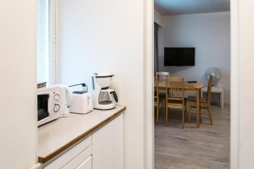 Η κουζίνα ή μικρή κουζίνα στο Apartamentos Joensuu - Kauppakatu 7