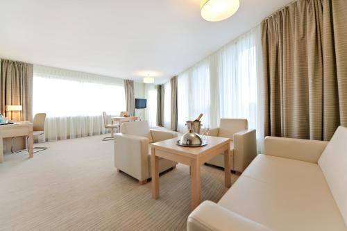 a hospital room with chairs and a table at Hotel Interferie Medical SPA in Świnoujście