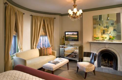 a living room with a couch and a fireplace at Clarendon Square in Boston