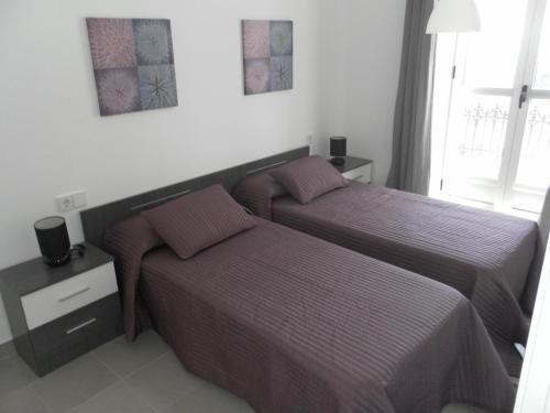 Posteľ alebo postele v izbe v ubytovaní Carrer de Dénia