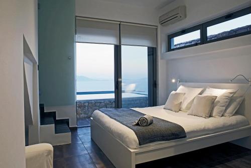 Ένα ή περισσότερα κρεβάτια σε δωμάτιο στο Seaview Salty villa