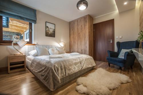 Postel nebo postele na pokoji v ubytování Aparthotel Góralski Spa & Restaurant