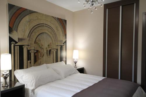 Ένα ή περισσότερα κρεβάτια σε δωμάτιο στο Alvear Suites