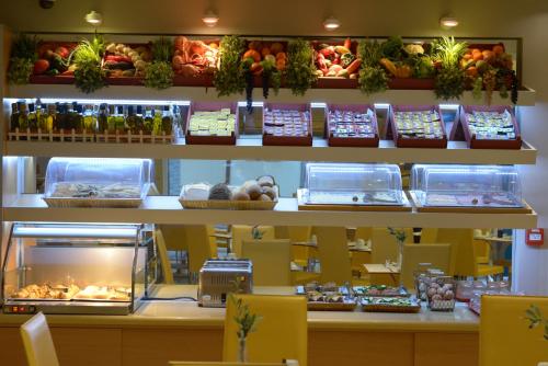 a store with shelves filled with different types of food at Kastro Hotel in Heraklio Town
