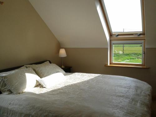 A bed or beds in a room at Blackberry Lodge Accommodation