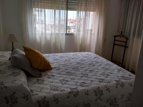 Un pat sau paturi într-o cameră la Club del Mar