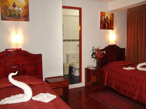 Katil atau katil-katil dalam bilik di Hotel Inkayra